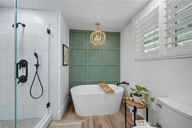 a utility room with cabinets washer and dryer