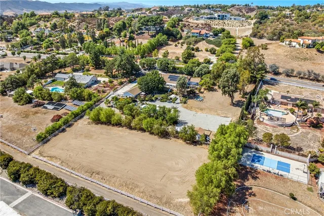 a view of a swimming pool with a yard