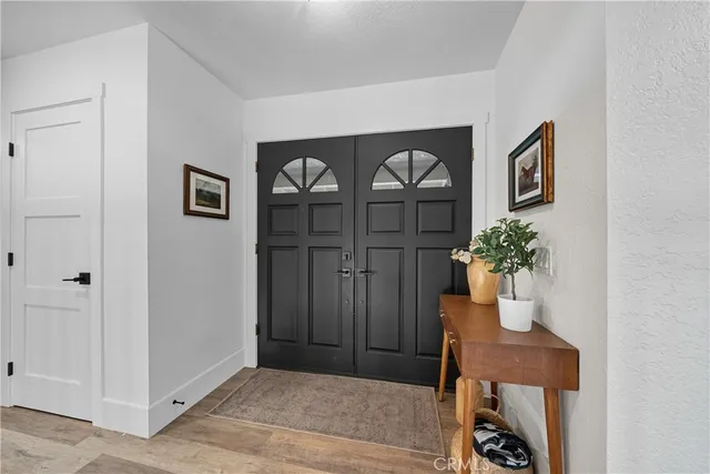 a view of a hallway with seating area