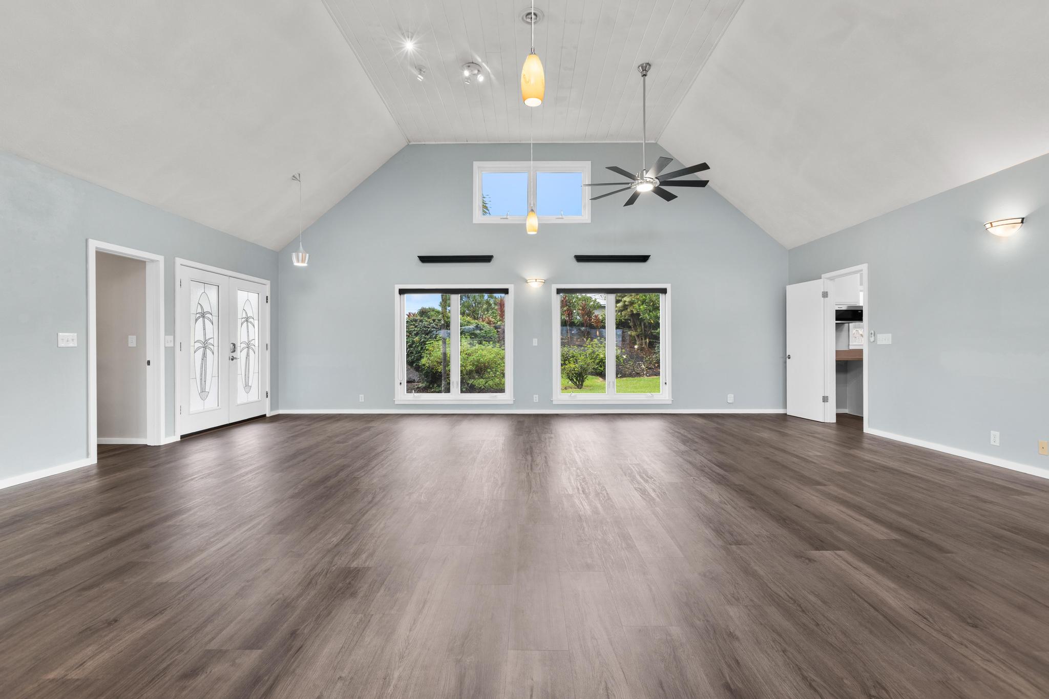 234 Kipa Street Hilo, HI 96720 - Photo 18 of 30 an empty room with wooden floor and windows