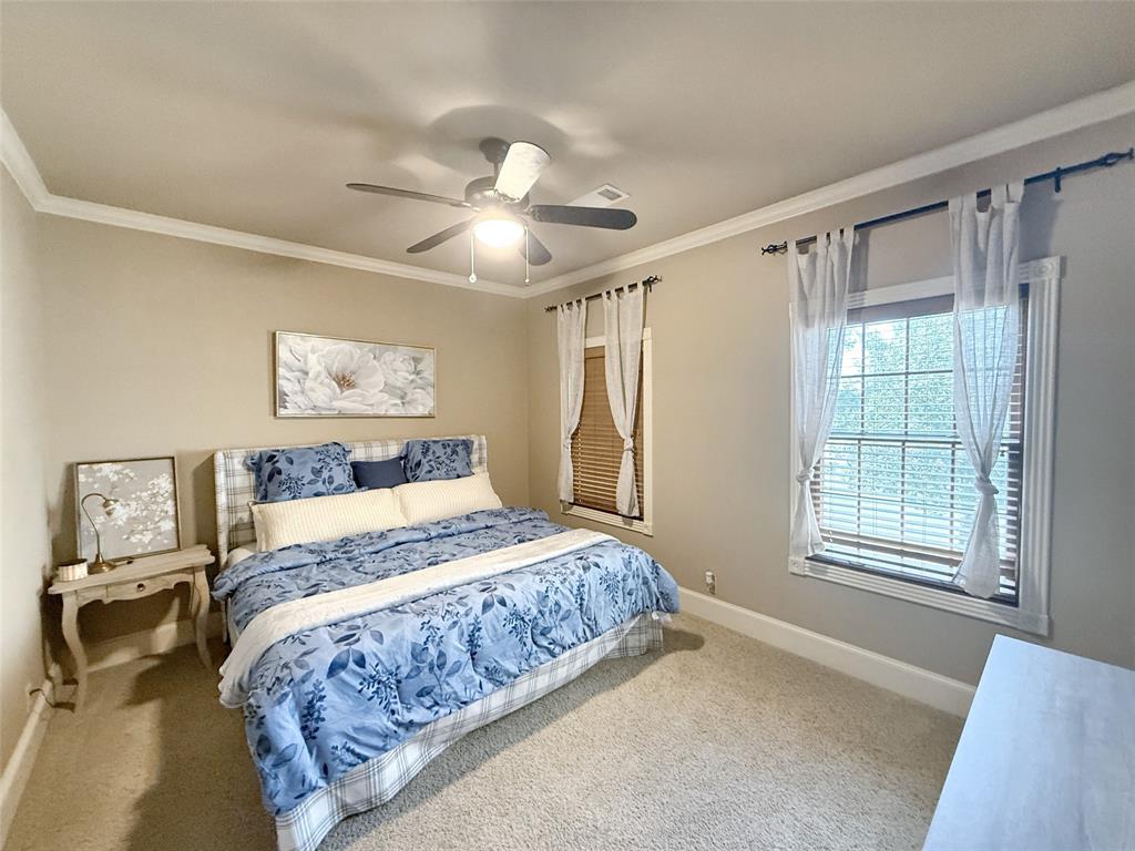 1026 Farm To Market Road 131 Denison, TX 75020 - Photo 20 of 40 a bedroom with a large bed and a window