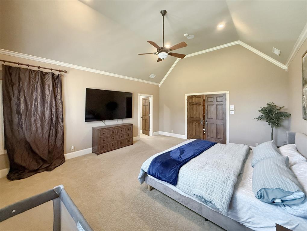 1026 Farm To Market Road 131 Denison, TX 75020 - Photo 24 of 40 a bedroom with a bed a window and a television