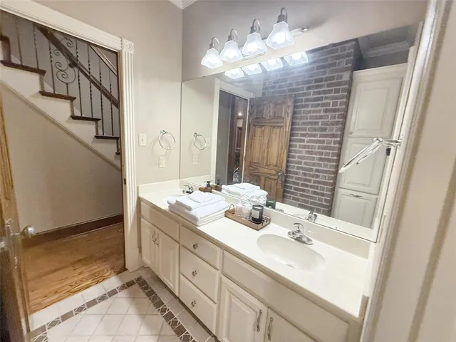 a bathroom with a double vanity sink mirror and