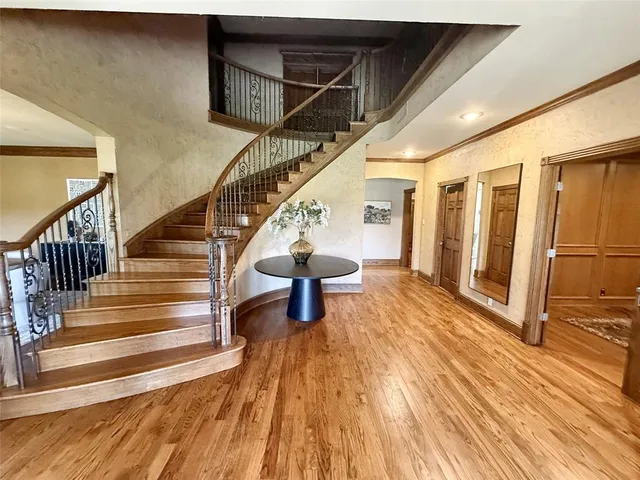 a view of entryway with wooden floor