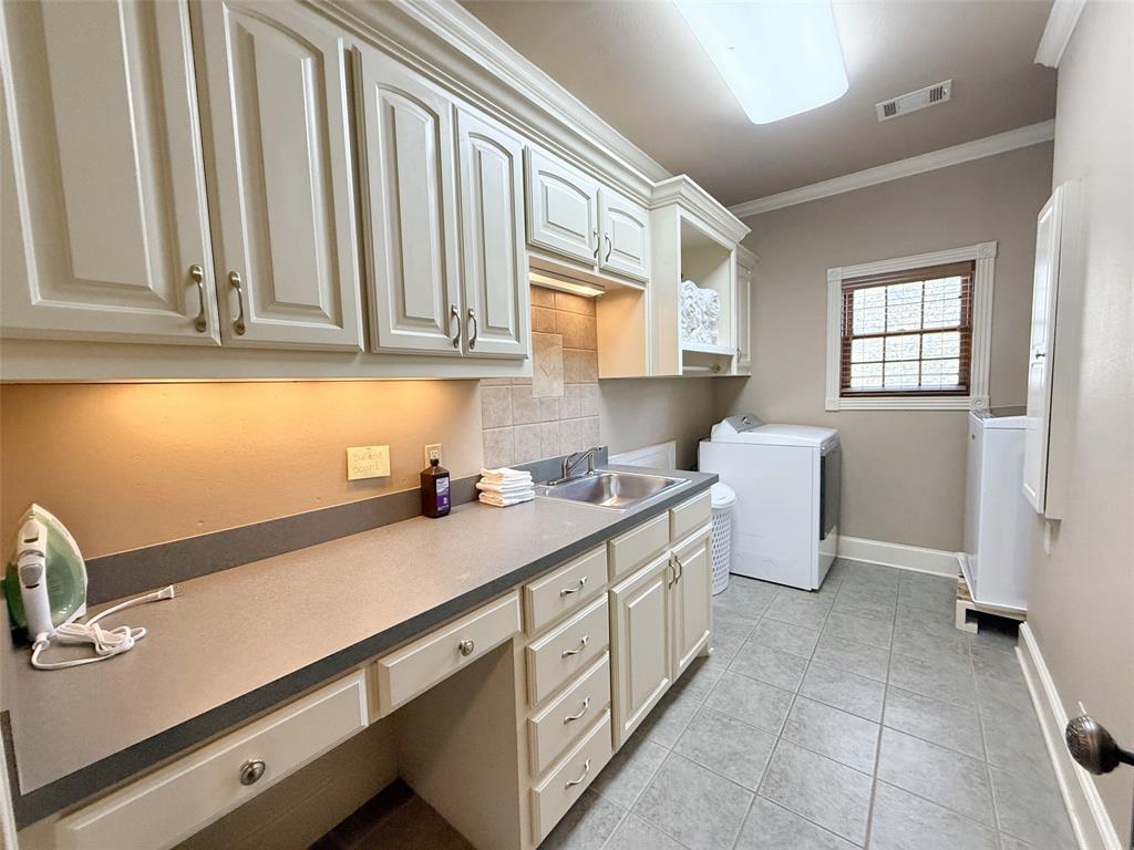 1026 Farm To Market Road 131 Denison, TX 75020 - Photo 31 of 40 a kitchen with a sink cabinets and appliances