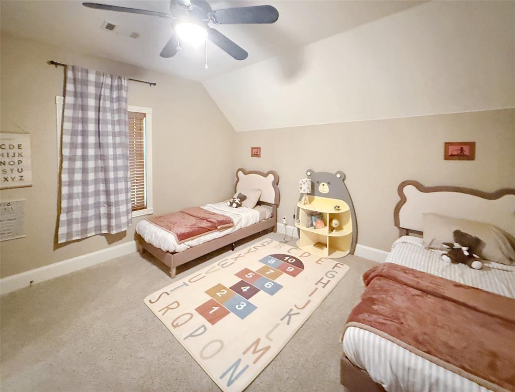 1026 Farm To Market Road 131 Denison, TX 75020 - Photo 32 of 40 a bedroom with a bed and wooden floor