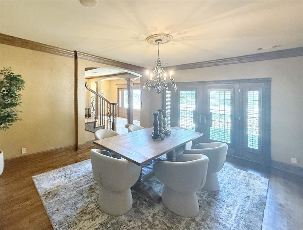 1026 Farm To Market Road 131 Denison, TX 75020 - Photo 5 of 40 a dining room with wooden floor and a chandelier