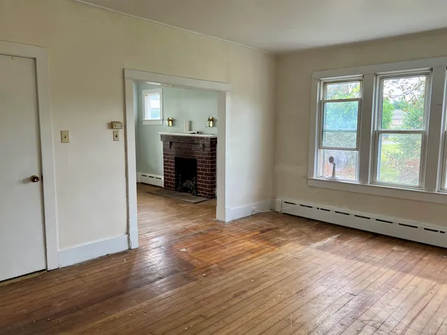 a view of a livingroom with wooden floor