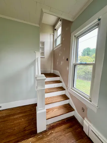 a view of a hallway with seating area