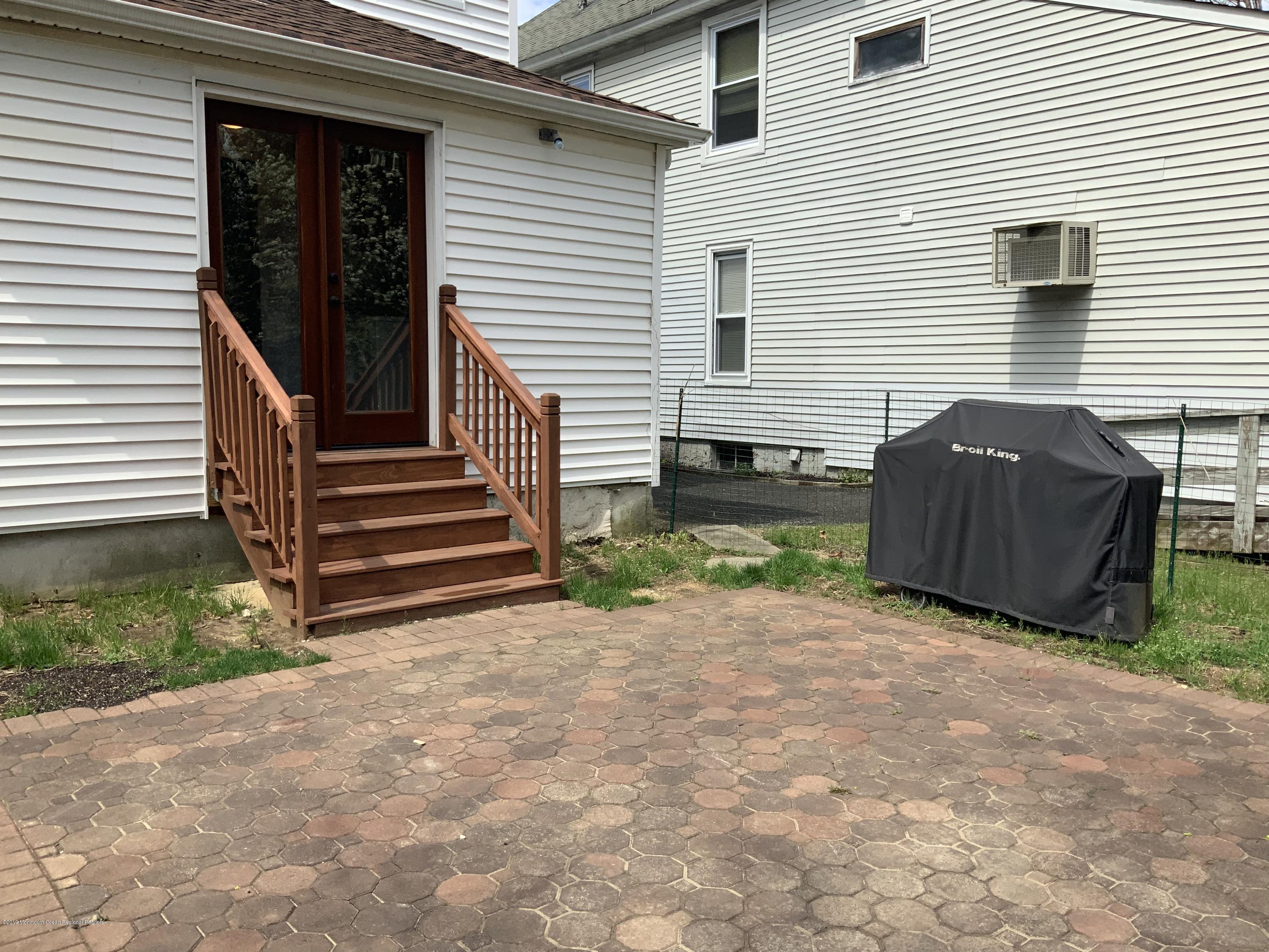 15 Spring Street Red Bank, NJ 07701 - Photo 14 of 30 a view of a house with backyard and wooden fence