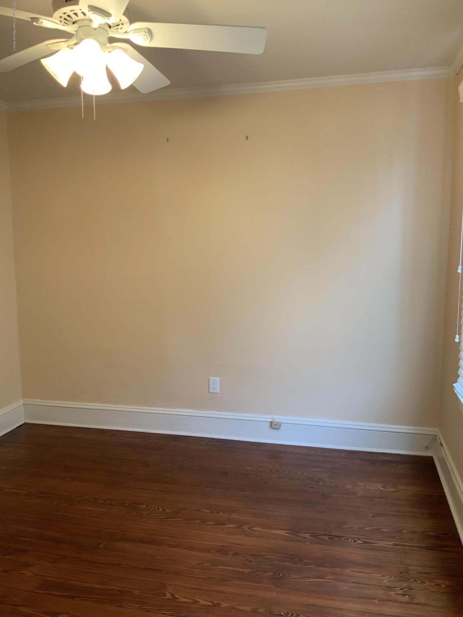 15 Spring Street Red Bank, NJ 07701 - Photo 16 of 30 a view of an empty room and window