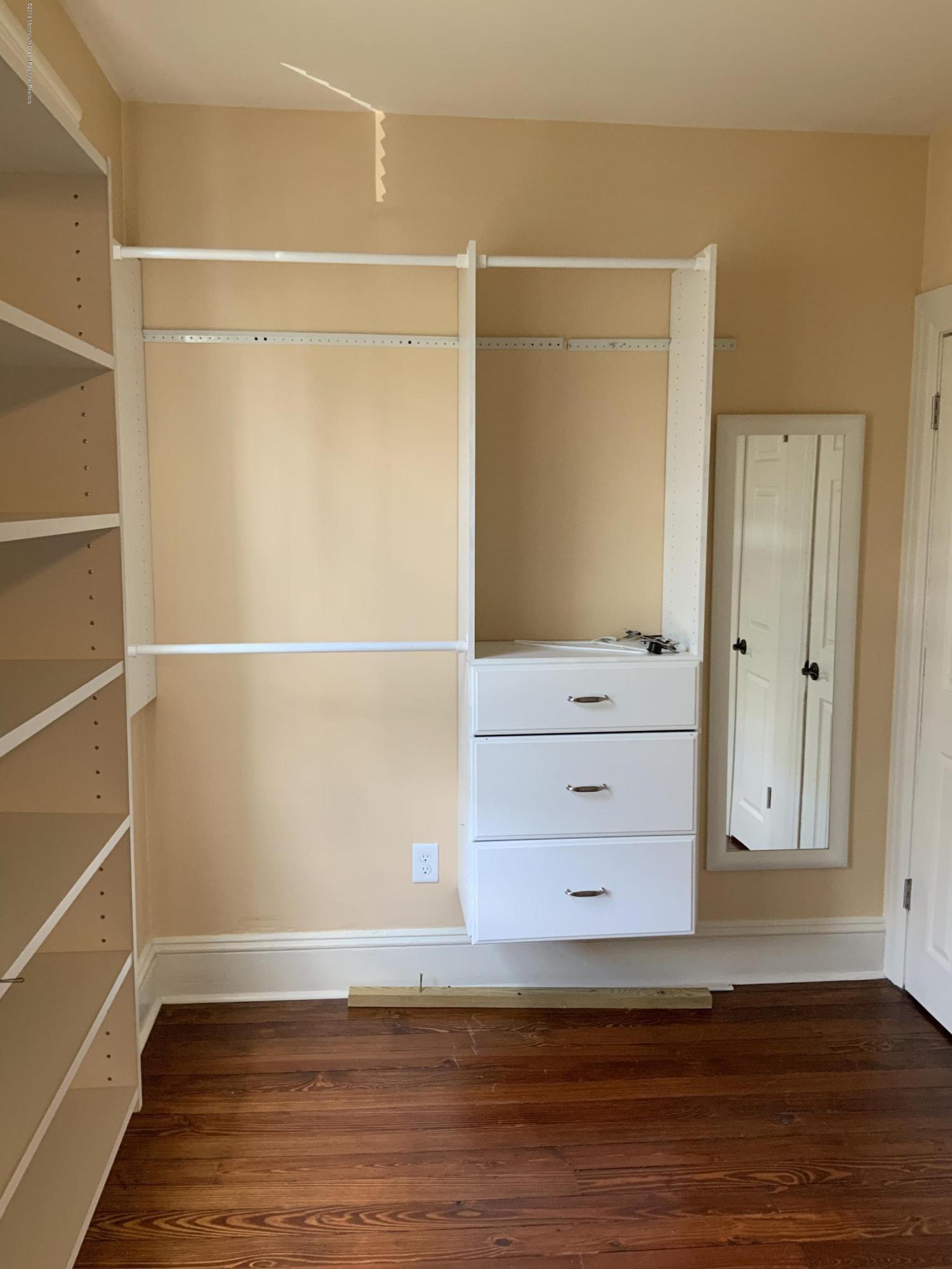 15 Spring Street Red Bank, NJ 07701 - Photo 17 of 30 a view of an empty walk in closet