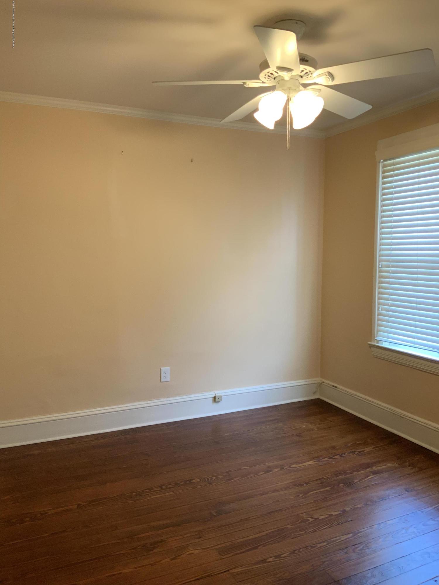 15 Spring Street Red Bank, NJ 07701 - Photo 20 of 30 a view of a room with wooden floor and fan