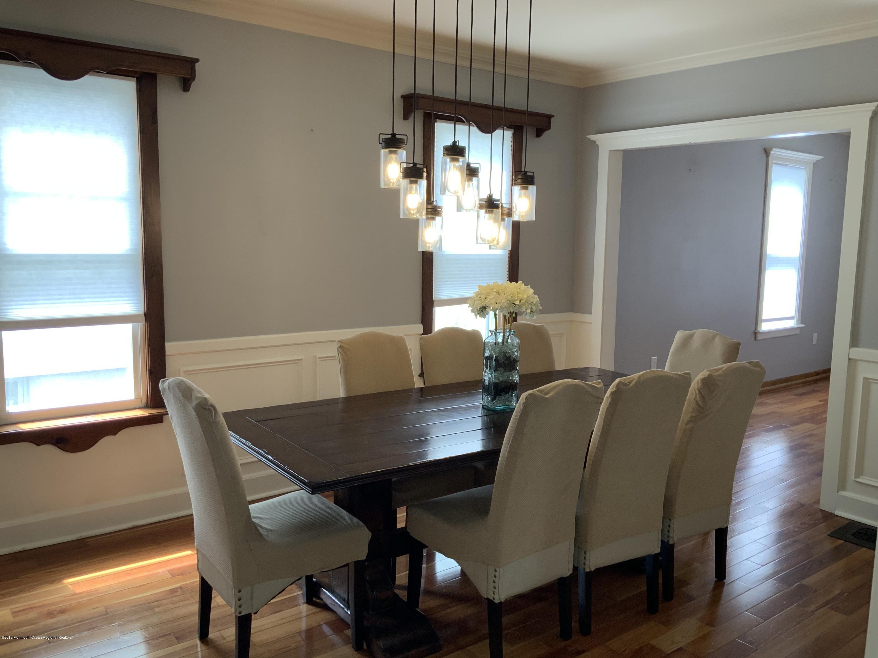 15 Spring Street Red Bank, NJ 07701 - Photo 3 of 30 a view of a dining room with furniture window and wooden floor