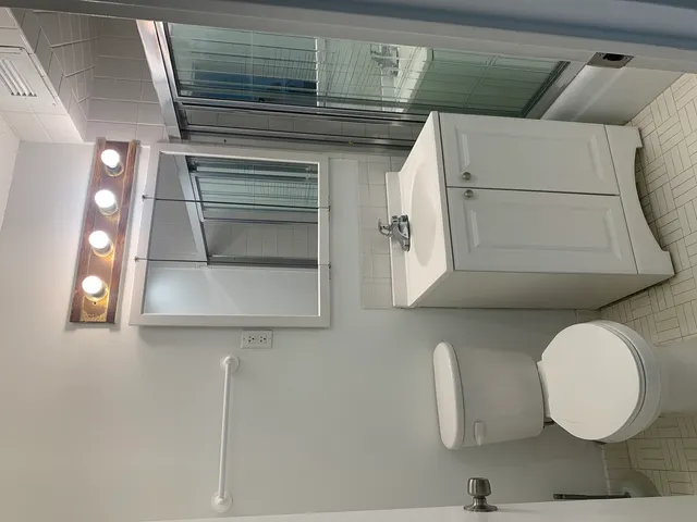 a bathroom with a sink and mirror