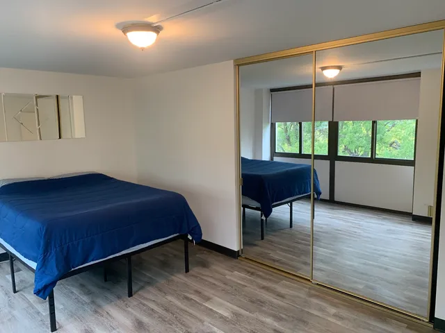 a room with a bed and a window