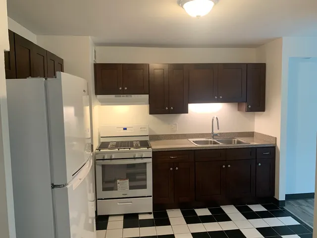 a kitchen with a sink and a stove
