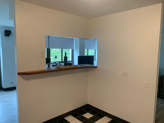 a living room with a couch and a large window