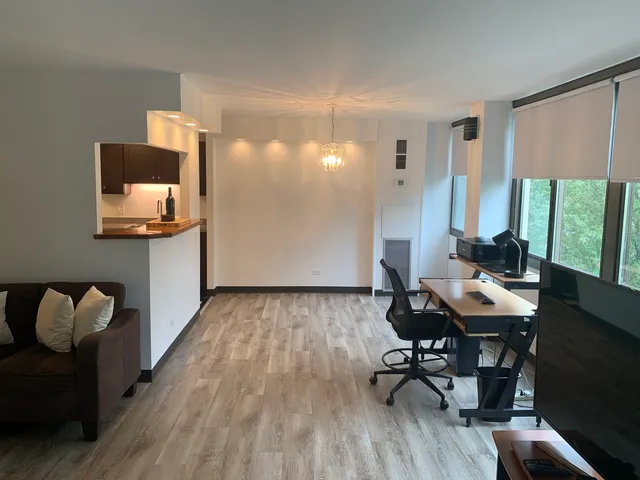 a workspace with furniture and wooden floor