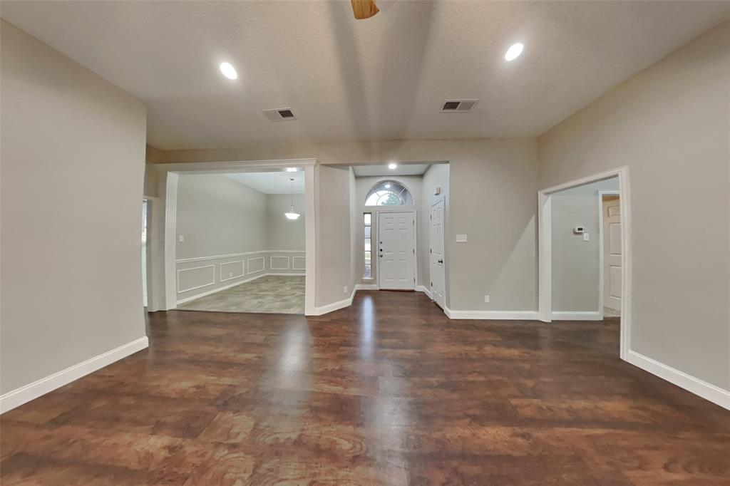 1526 Brittany Lane Mansfield, TX 76063 - Photo 2 of 18 Foyer featuring dark wood finished floors, recessed lighting, and a textured ceiling