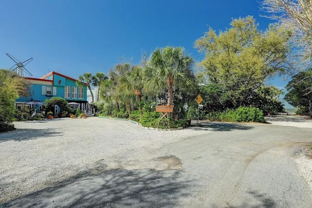 a view of a street with a building in the background