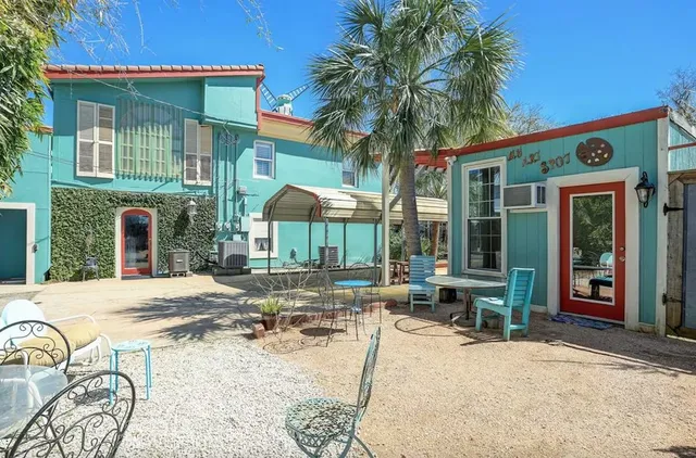 a view of a dinning tables and chairs in patio of the house