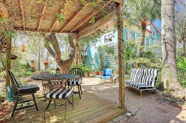 a view of a patio with a table and chairs