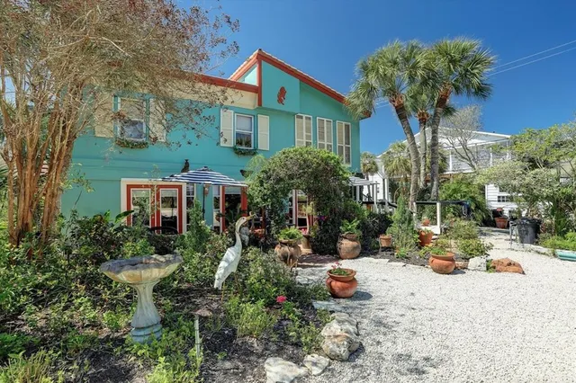 a view of a chair and tables in the patio