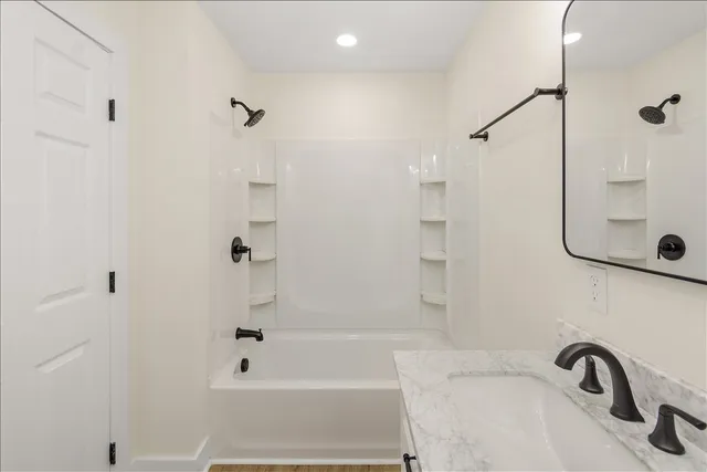 a bathroom with a sink and a shower