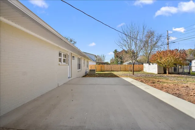 a view of a house with snow on the road