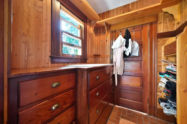 a view of an empty room with a ceiling fan