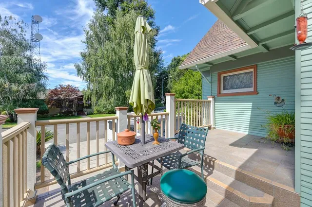 an aerial view of a house with a yard and potted plants