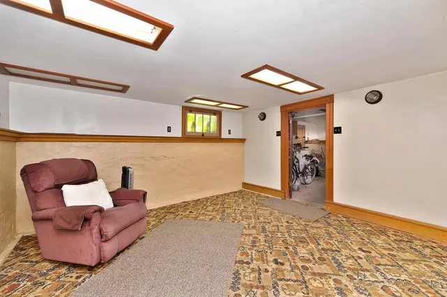 an aerial view of a residential houses with outdoor space and lake view