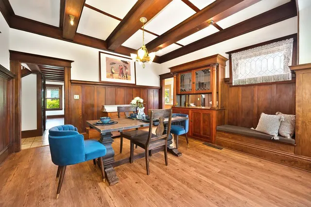 a kitchen with sink and large window