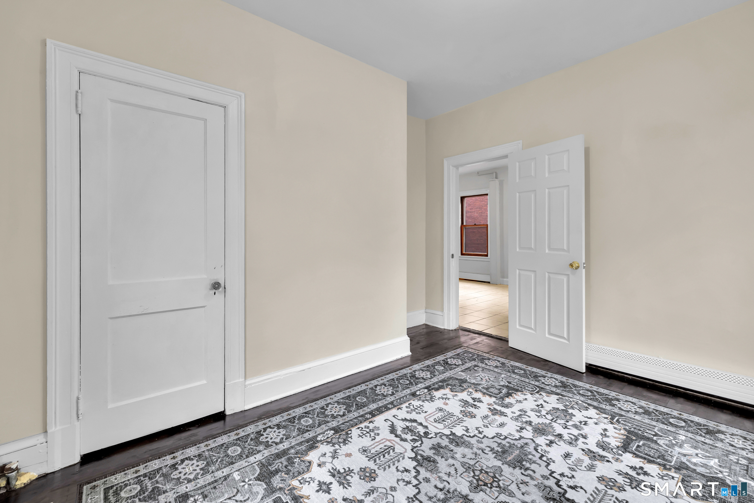 72 Sterling Street Hartford, CT 06112 - Photo 13 of 25 a view of a room with window and wooden floor