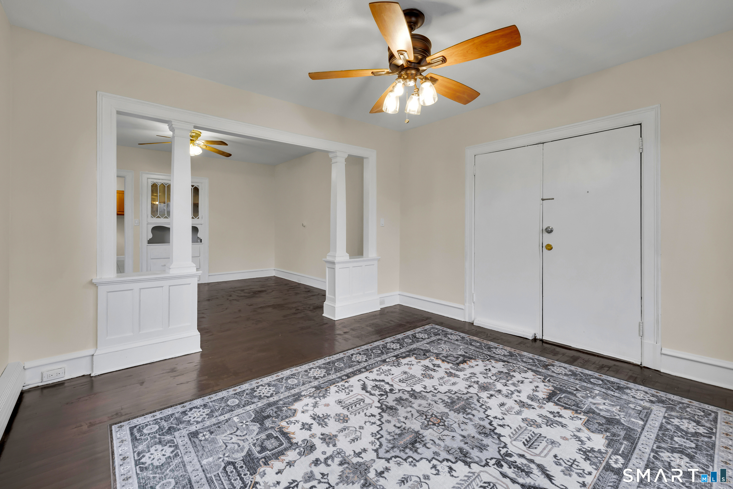 72 Sterling Street Hartford, CT 06112 - Photo 3 of 25 wooden floor in an empty room with a window
