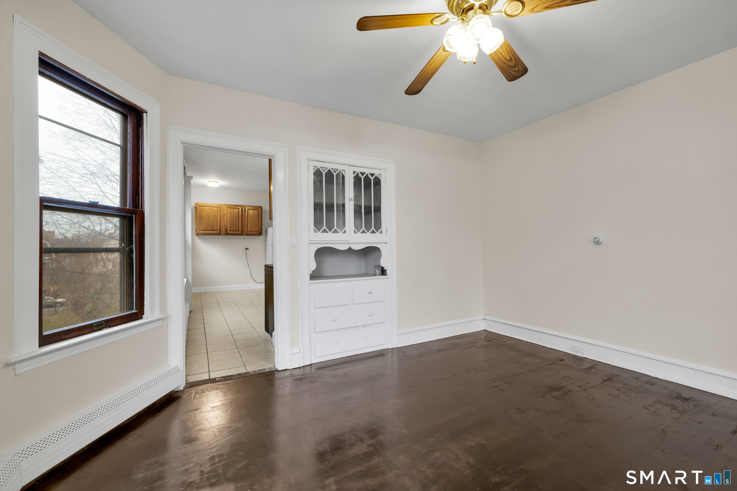 72 Sterling Street Hartford, CT 06112 - Photo 7 of 25 a view of empty room with wooden floor and fan