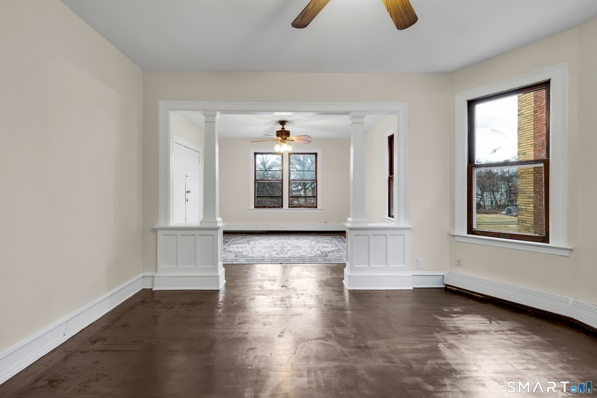 72 Sterling Street Hartford, CT 06112 - Photo 8 of 25 an empty room with windows and closet