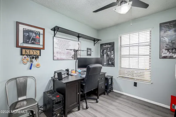 a view of a room with wooden floor and chair