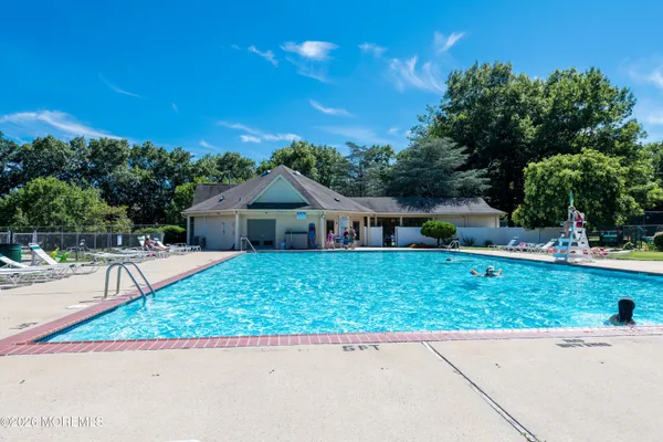 a view of a house with a yard porch and sitting area