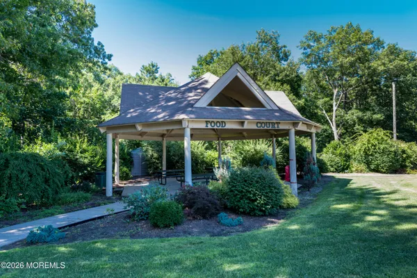 a view of a backyard with sitting area