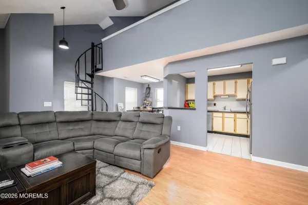 a view of a dining room with furniture and window