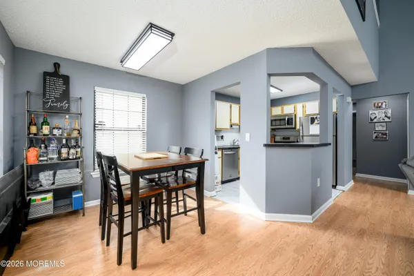 a kitchen with stainless steel appliances granite countertop a refrigerator sink and stove