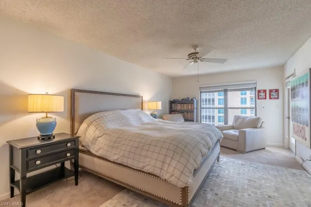 a bedroom with a bed and dresser