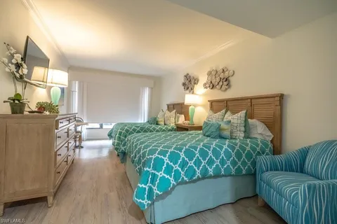 a bed room with a bed and a couch