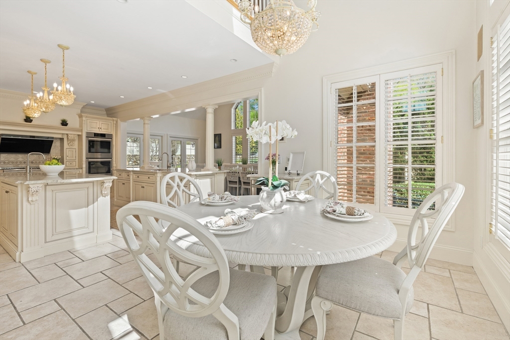 46 Porter Road Andover, MA 01810 - Photo 13 of 42 a view of a dining room with furniture a chandelier and wooden floor