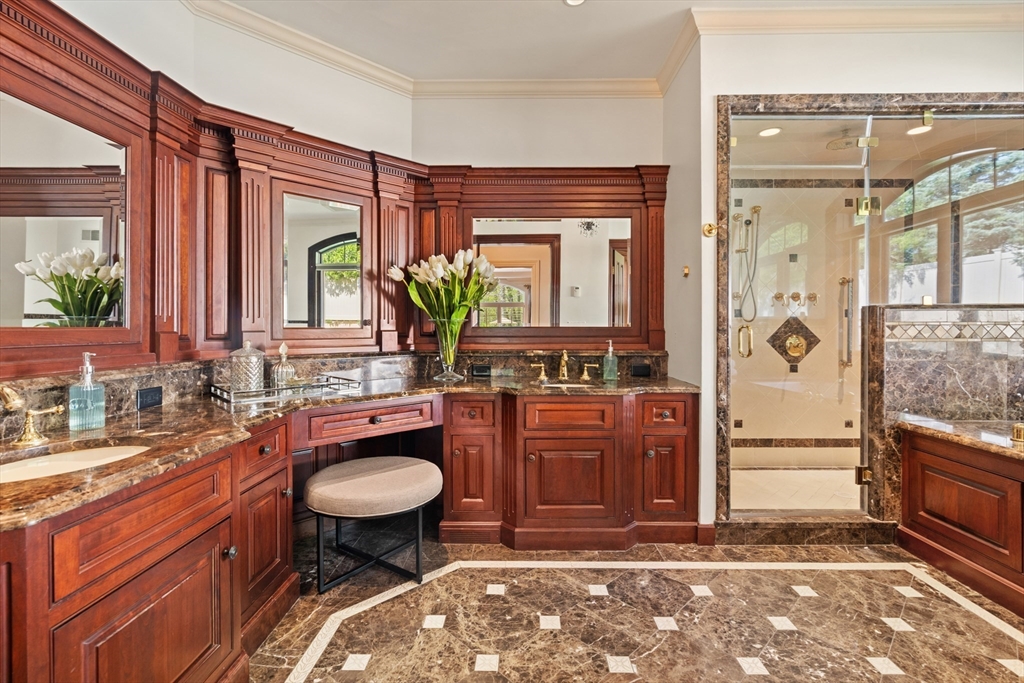 46 Porter Road Andover, MA 01810 - Photo 23 of 42 a spacious bathroom with a granite countertop sink and a mirror