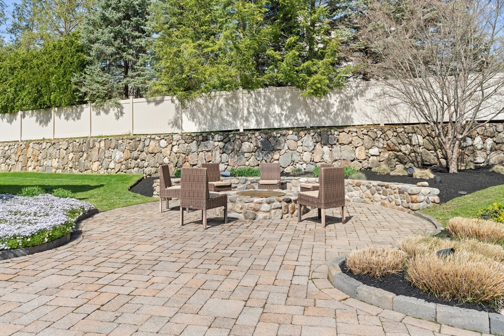 46 Porter Road Andover, MA 01810 - Photo 36 of 42 a lawn chairs sitting in a yard with swimming pool