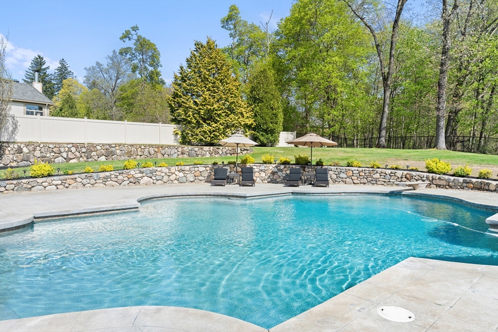 46 Porter Road Andover, MA 01810 - Photo 39 of 42 a view of a swimming pool with a garden