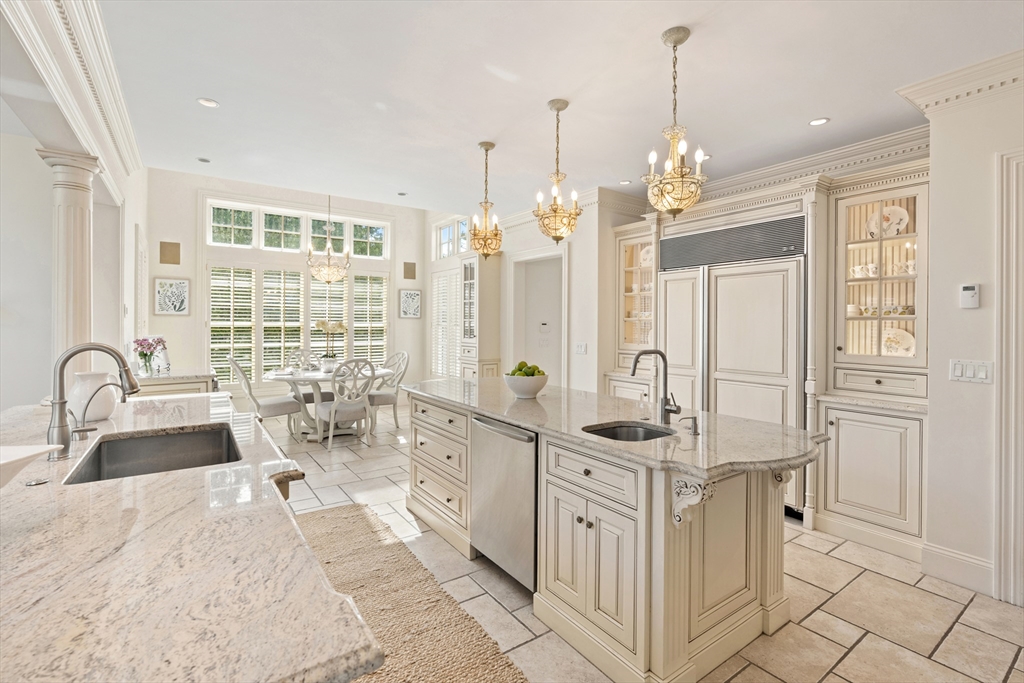 46 Porter Road Andover, MA 01810 - Photo 9 of 42 a bathroom with a double vanity sink a mirror a bathtub and shower